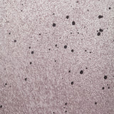 Close up of paint splatters in purple, gray and white.