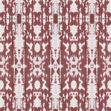 Detail of wallpaper in a painterly ikat print in rust and white.