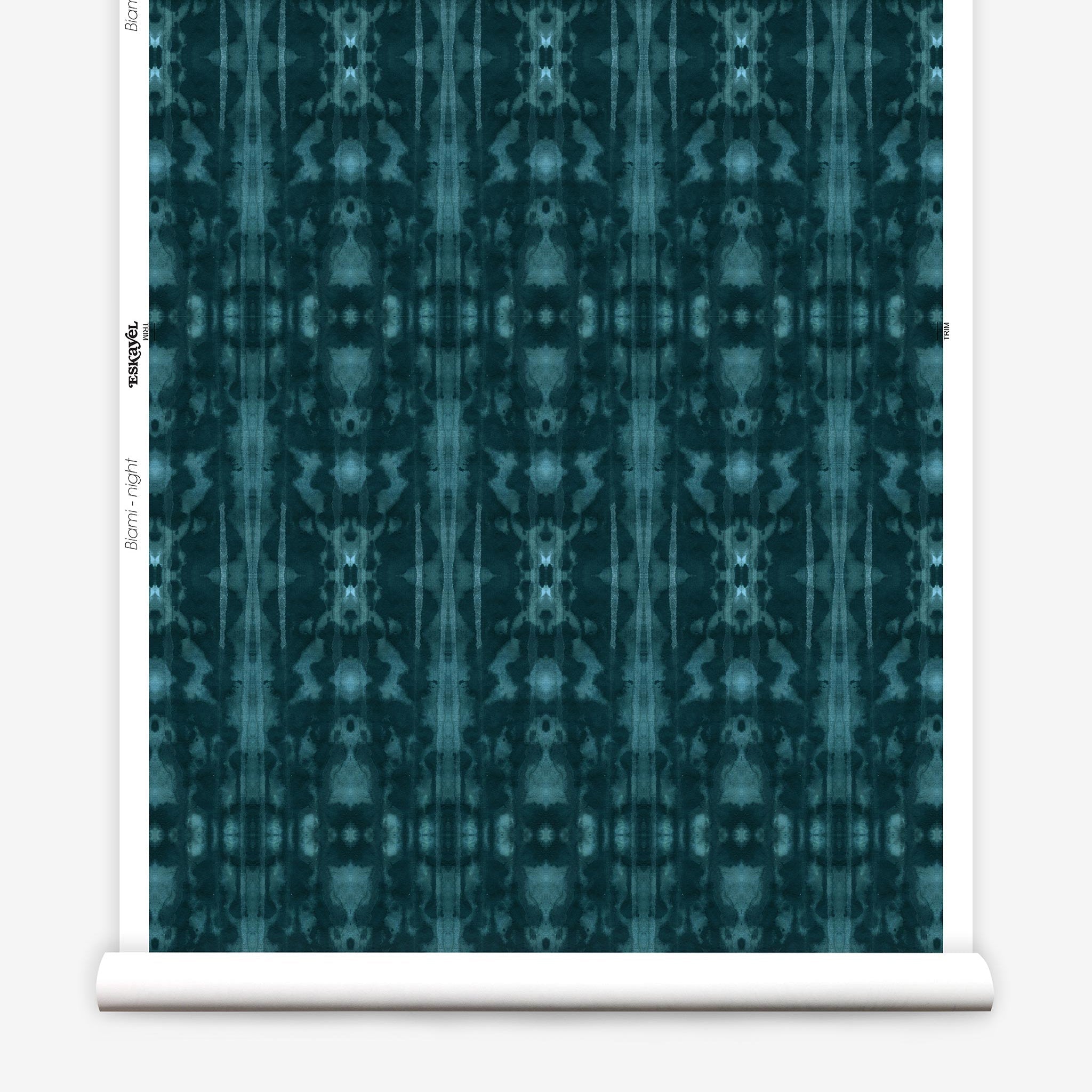 Partially unrolled wallpaper yardage in a painterly ikat print in turquoise and navy.