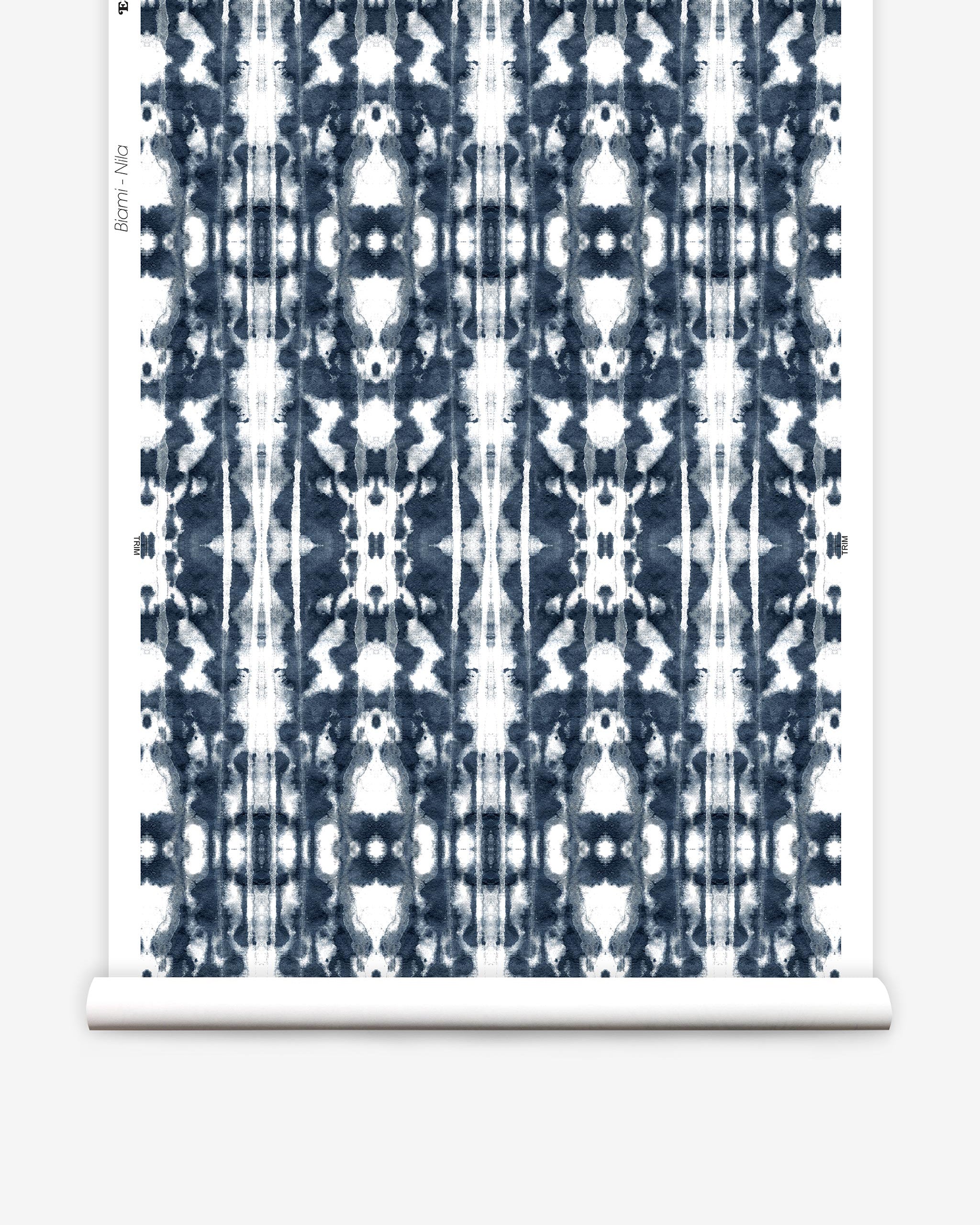 Partially unrolled wallpaper yardage in a painterly ikat print in navy and white.