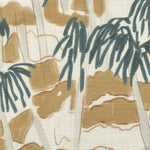 Close-up of fabric in a painterly palm tree print in shades of gray, brown and navy on a white field.