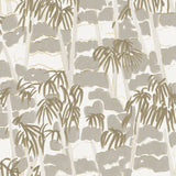 Detail of fabric in a painterly palm tree print in shades of gray and gold on a white field.