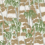 Detail of fabric in a painterly palm tree print in shades of green, gray and brown on a white field.