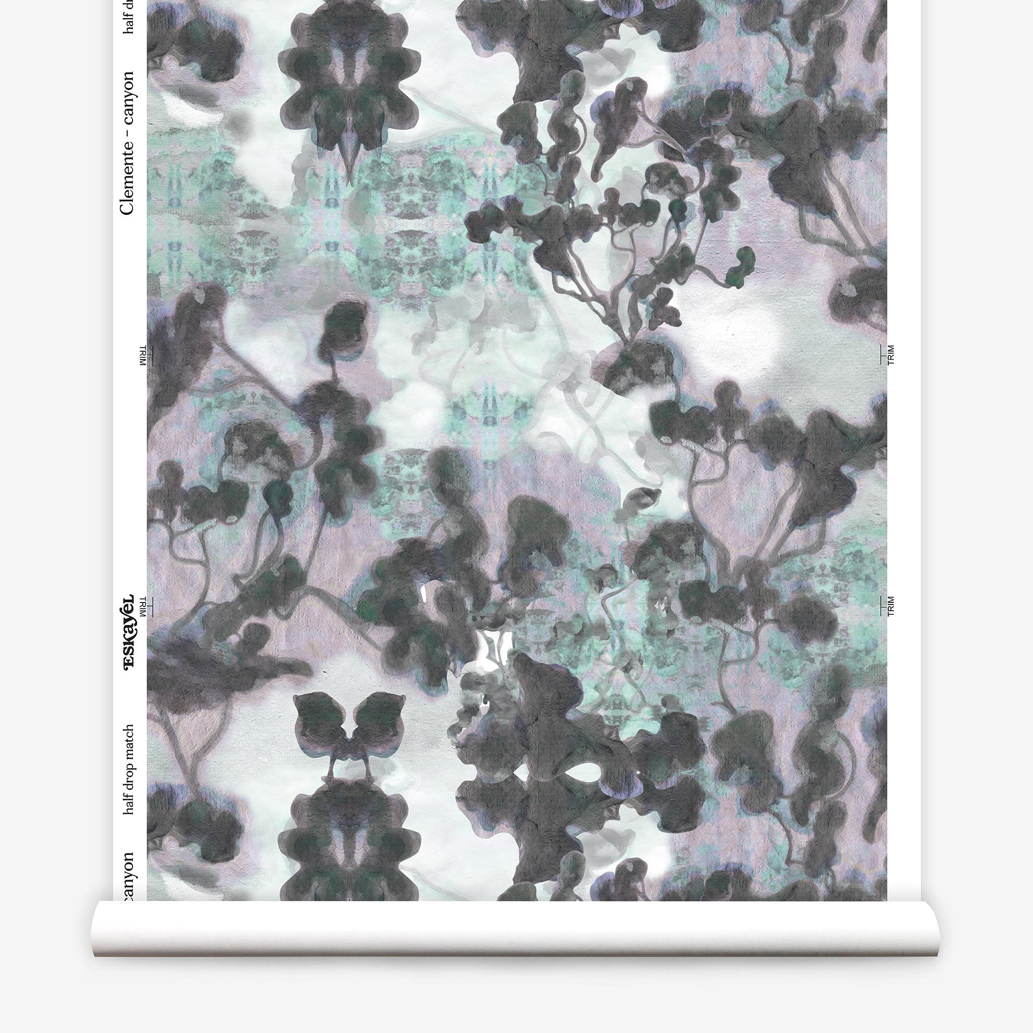 Partially unrolled wallpaper yardage in an abstract botanical print in gray, turquoise, purple and white.