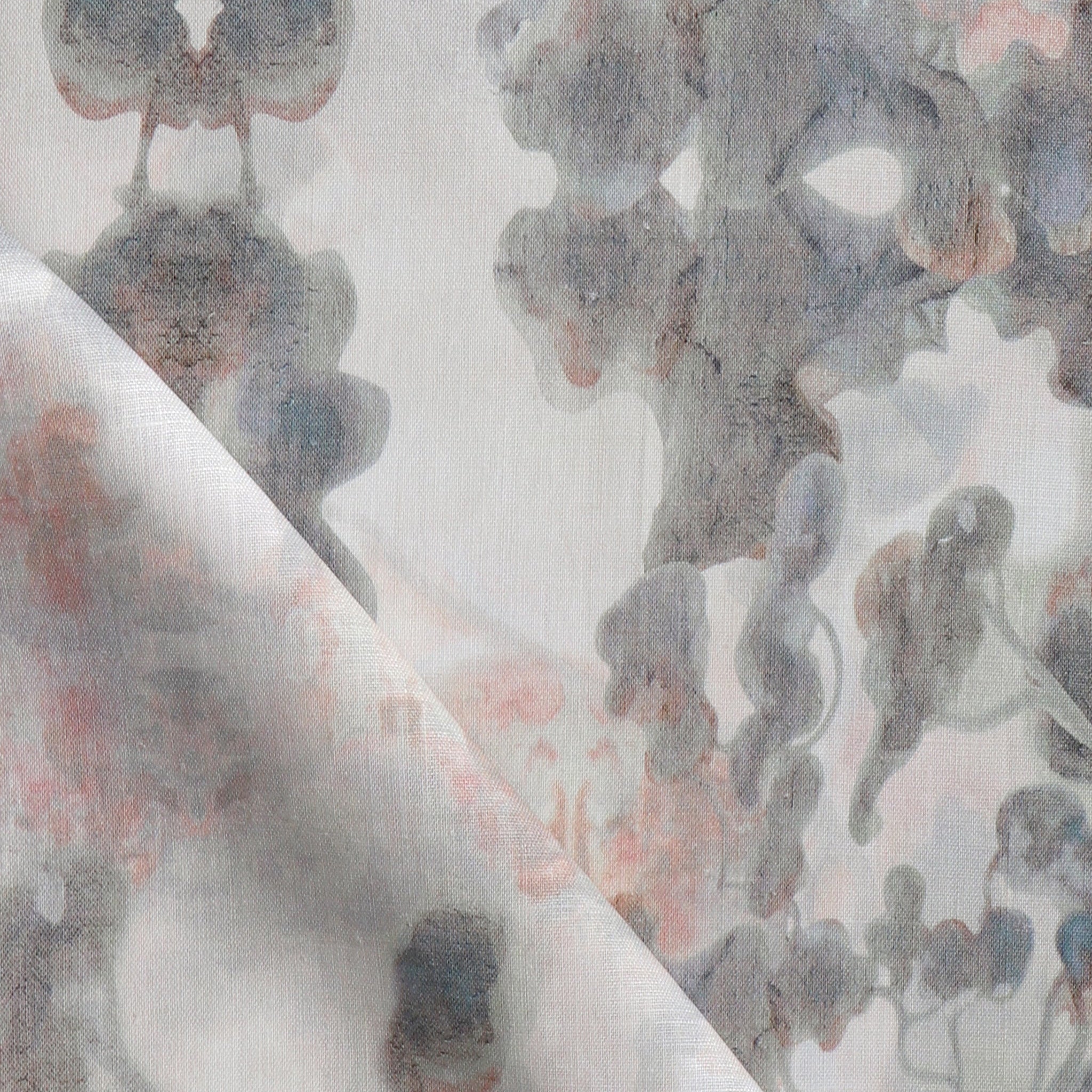 Detail of fabric in an abstract botanical print in shades of pink and gray on a greige field.