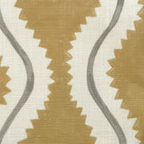 Close-up of fabric in a playful curvy stripe print in white and gray on a mustard field.