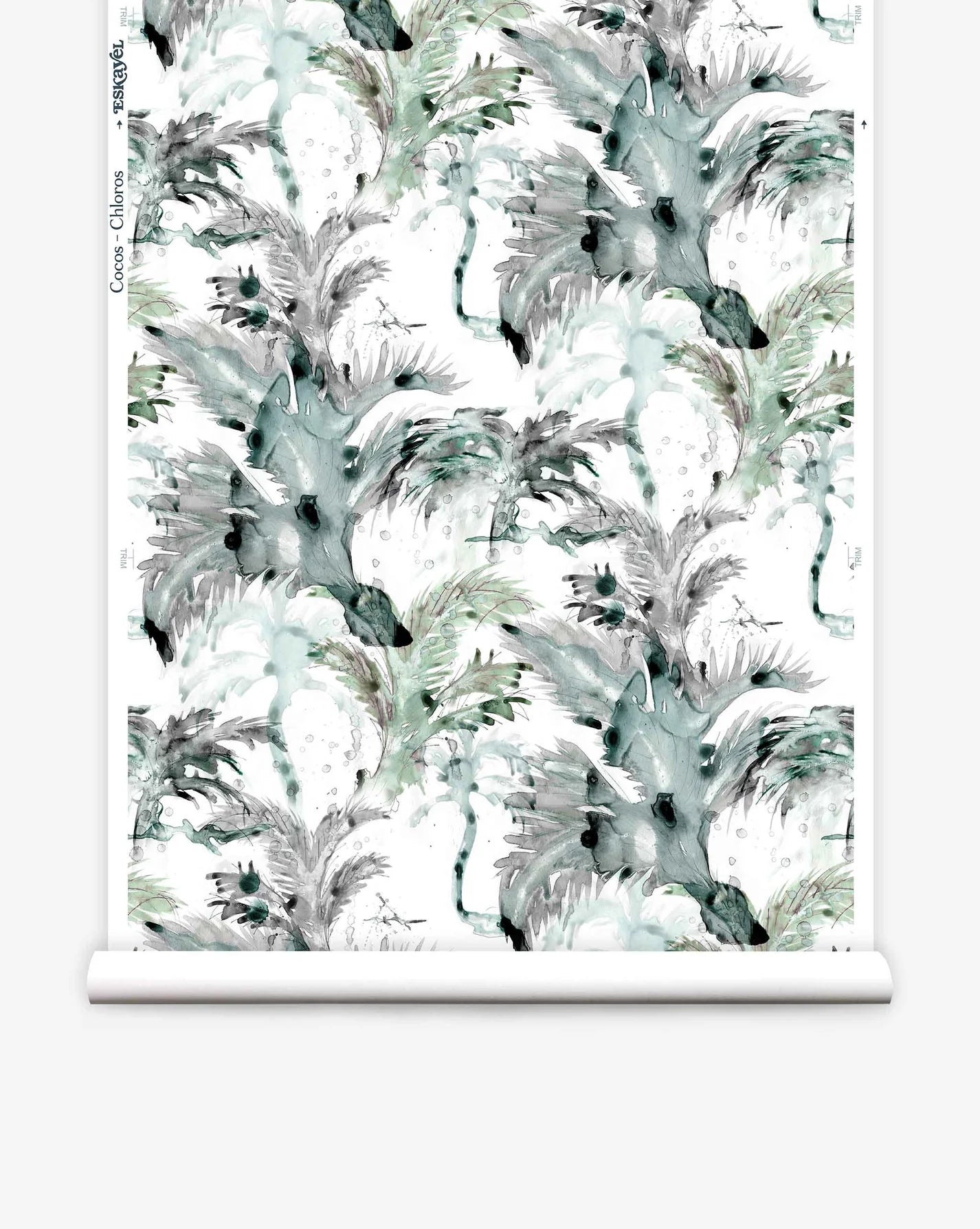 Partially unrolled wallpaper yardage in a painterly palm tree print in shades of gray, blue and green on a white field.