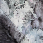 Detail of fabric in a painterly palm leaf print in shades of blue, pink and gray on a cream field.