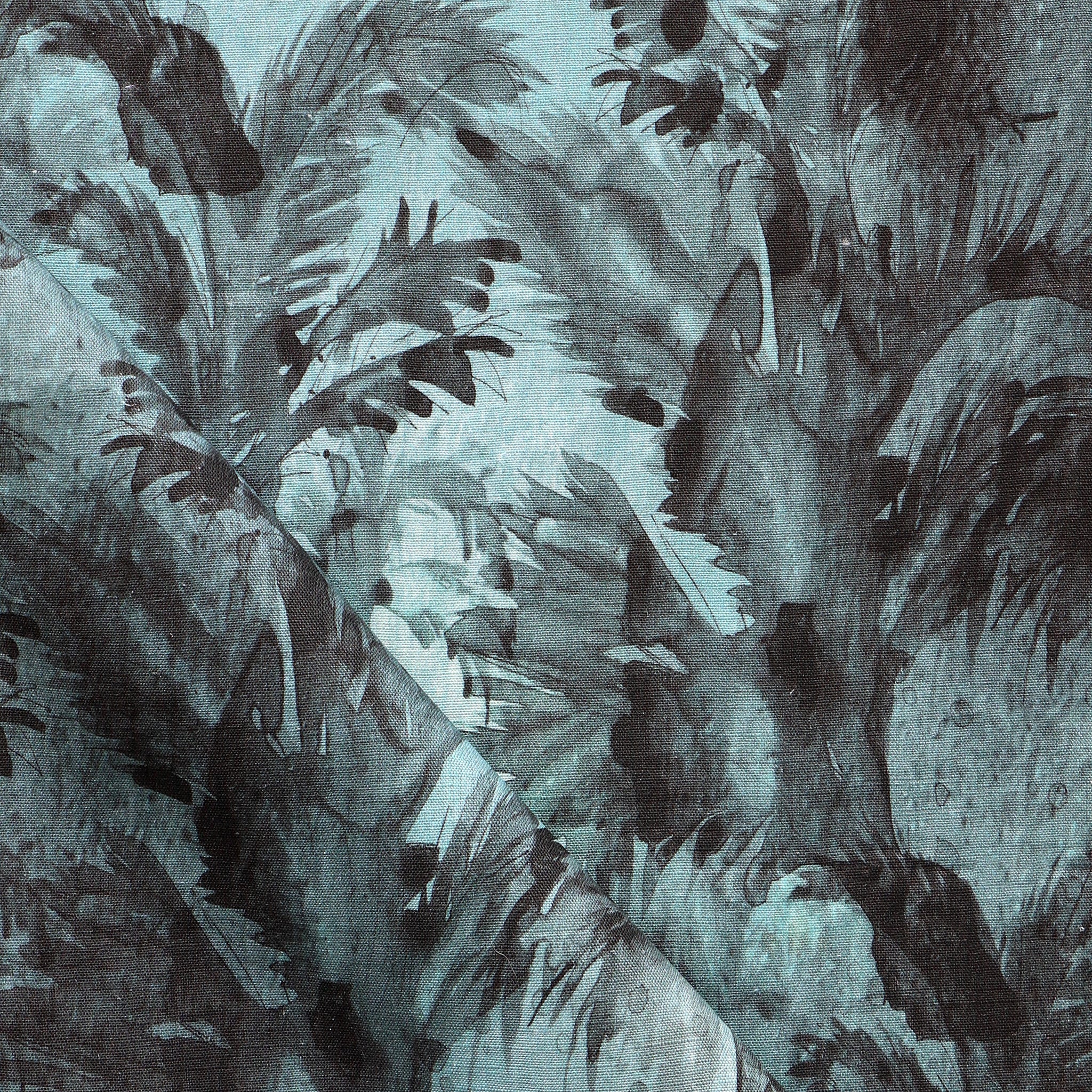 Detail of fabric in a painterly palm leaf print in shades of turquoise and gray.