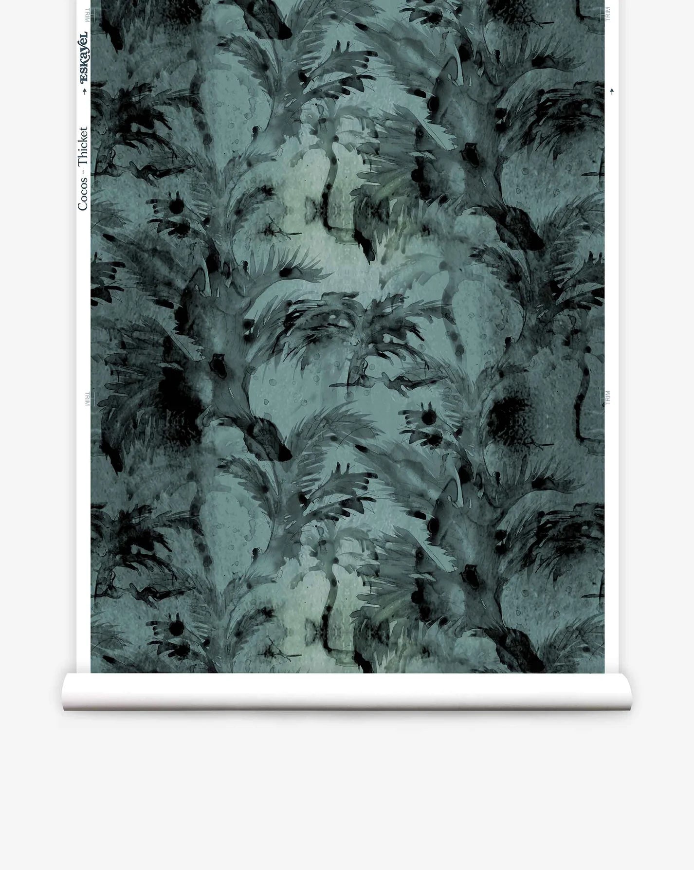 Partially unrolled wallpaper yardage in a painterly palm tree print in shades of gray and turquoise.