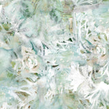 Detail of wallpaper in an abstract painted print in shades of green, tan and white.