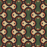 Detail of fabric in an interlocking curvilinear print in shades of green, pink, red and cream.