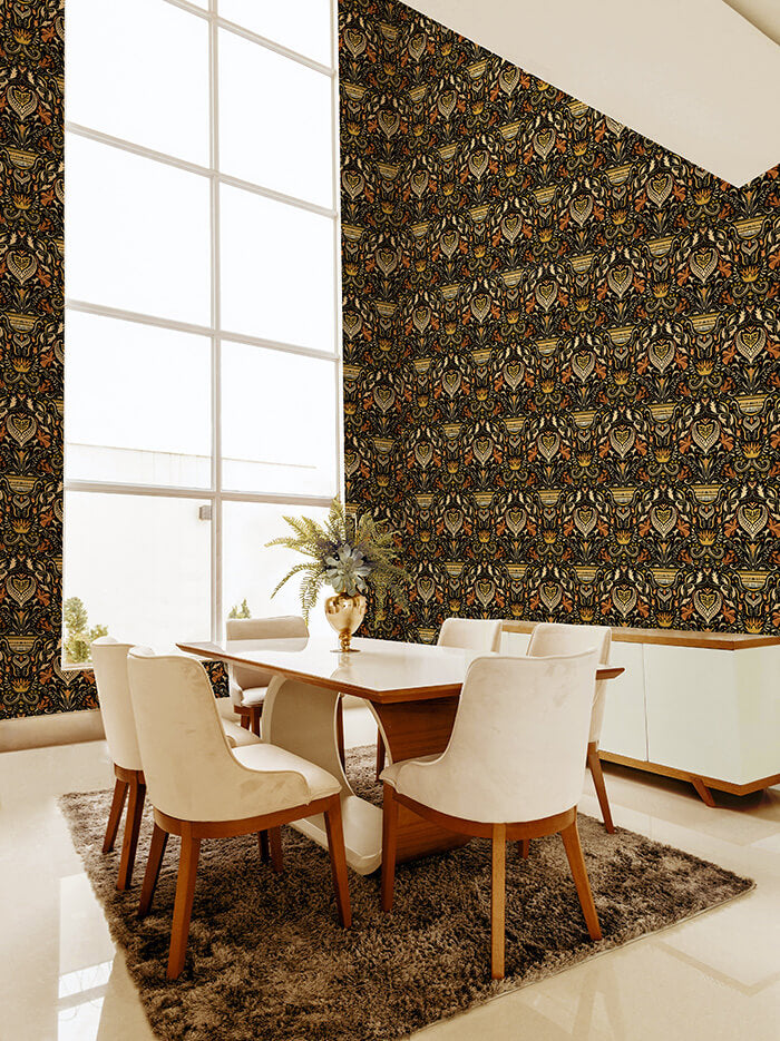 A modernist dining room with a tall window and walls papered in a floral damask print in cream, coral, gold and black.