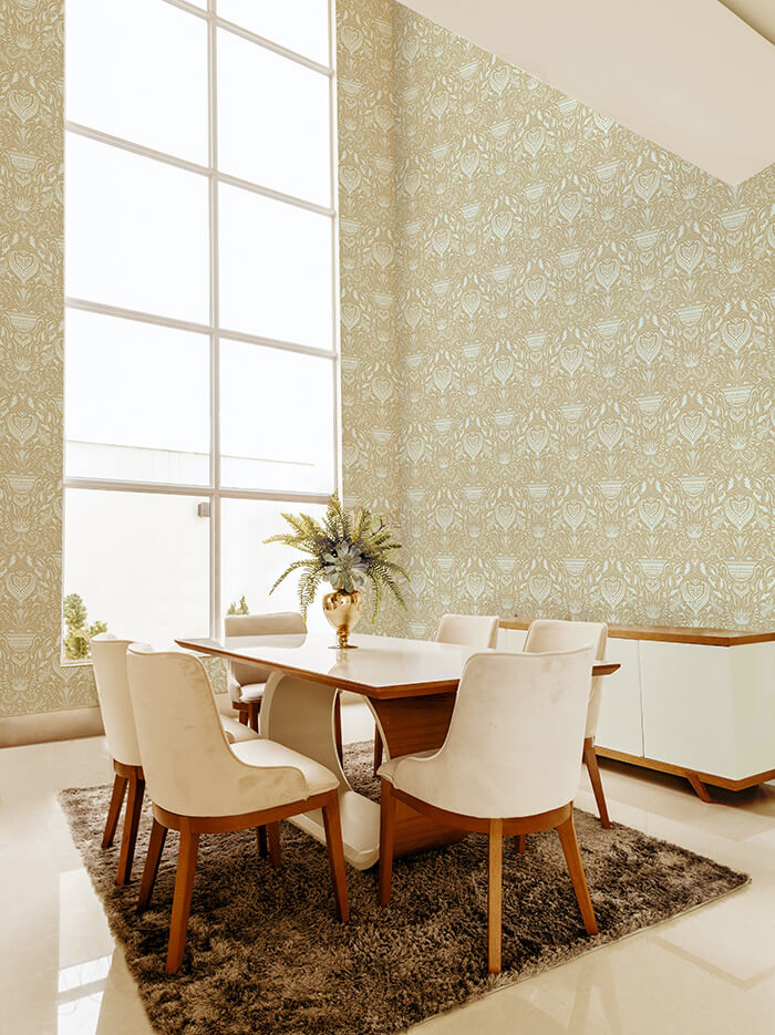 A modernist dining room with a tall window and walls papered in a floral damask print in cream and tan.