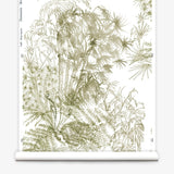 Partially unrolled wallpaper yardage in a painterly palm tree print in olive on a cream field.