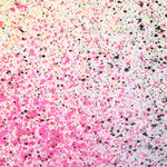 Close up of paint splatters in pink, black and yellow.