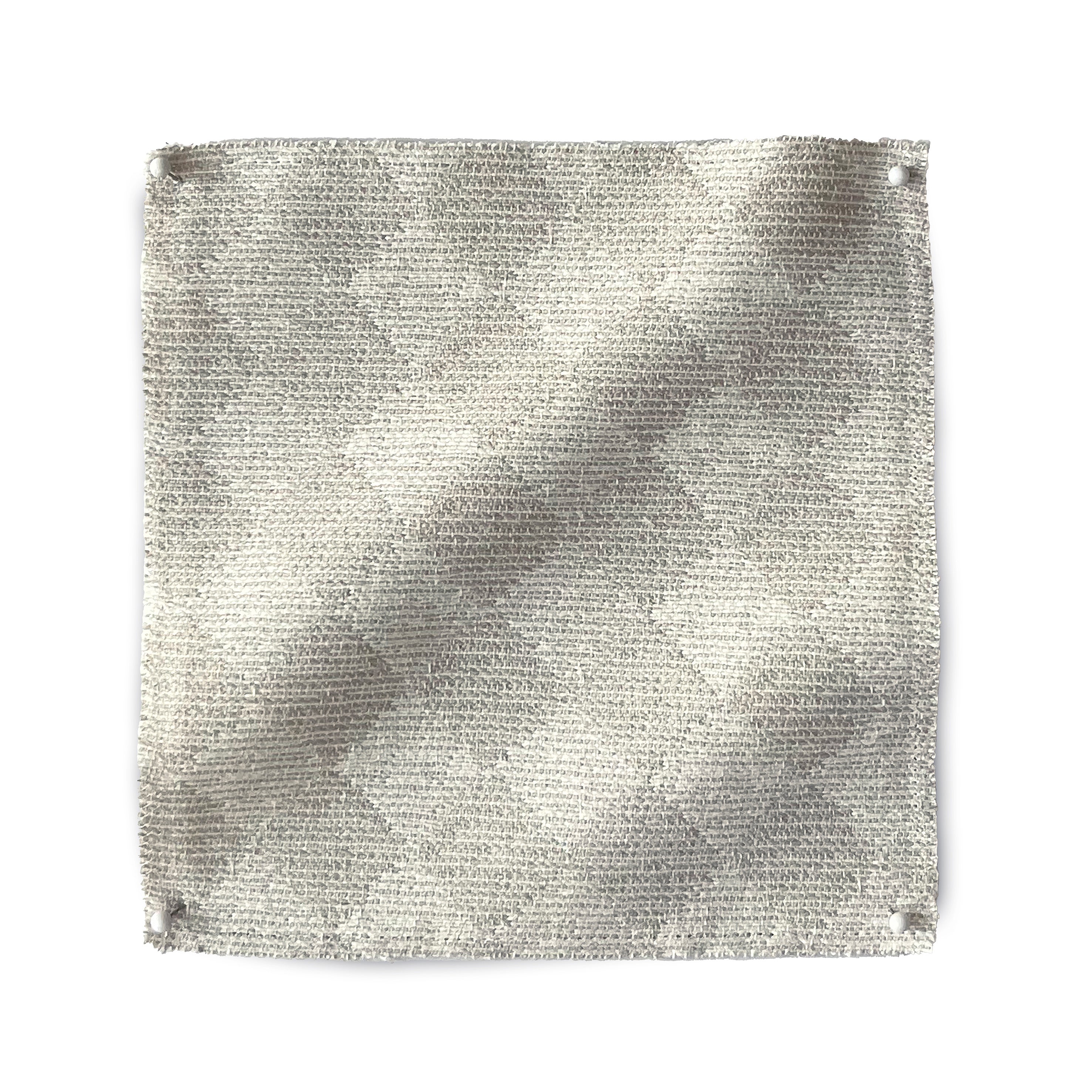 Square fabric swatch in a textural diamond print in cream.