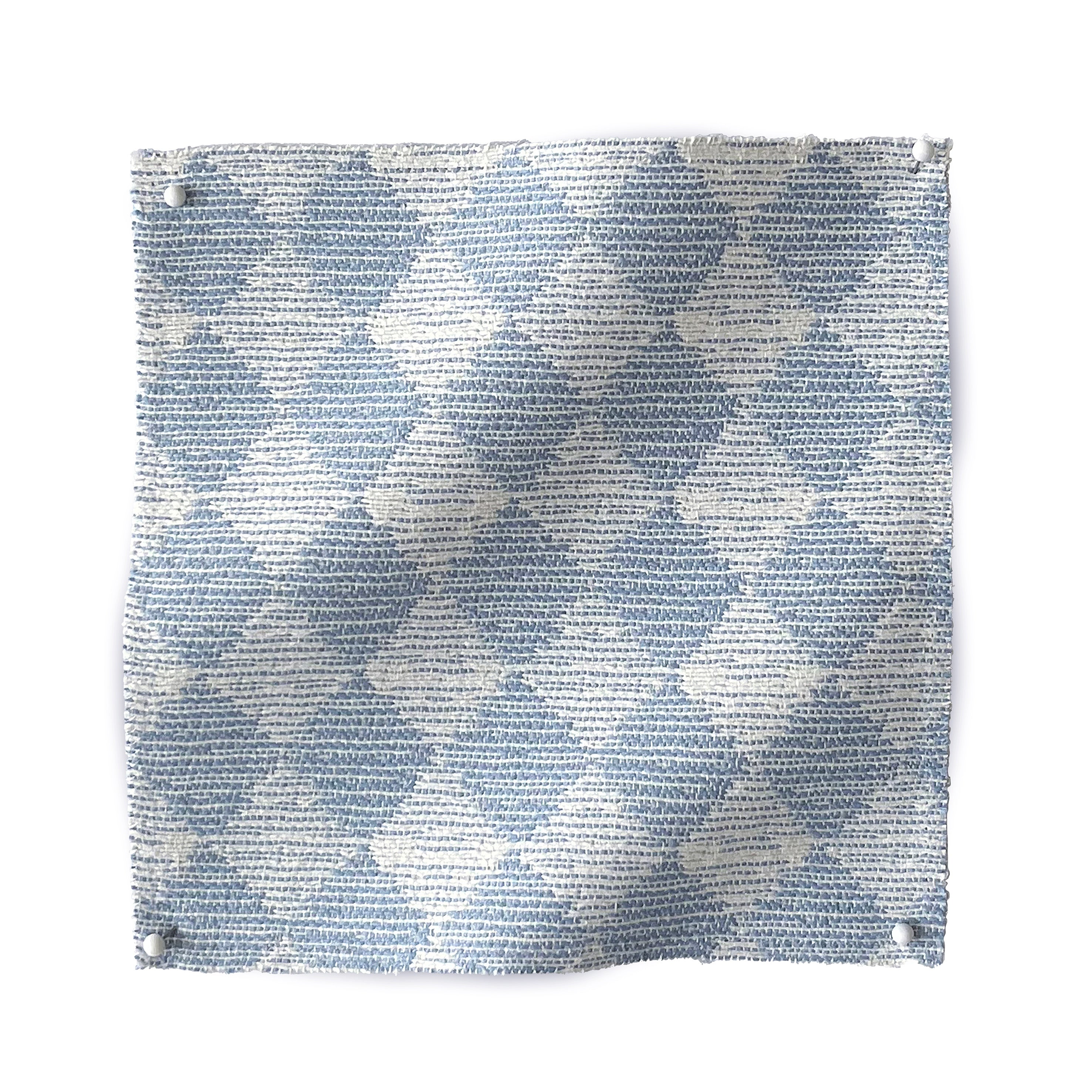 Square fabric swatch in a textural diamond print in light blue and white.