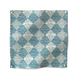 Square fabric swatch in a textural diamond print in blue and cream.