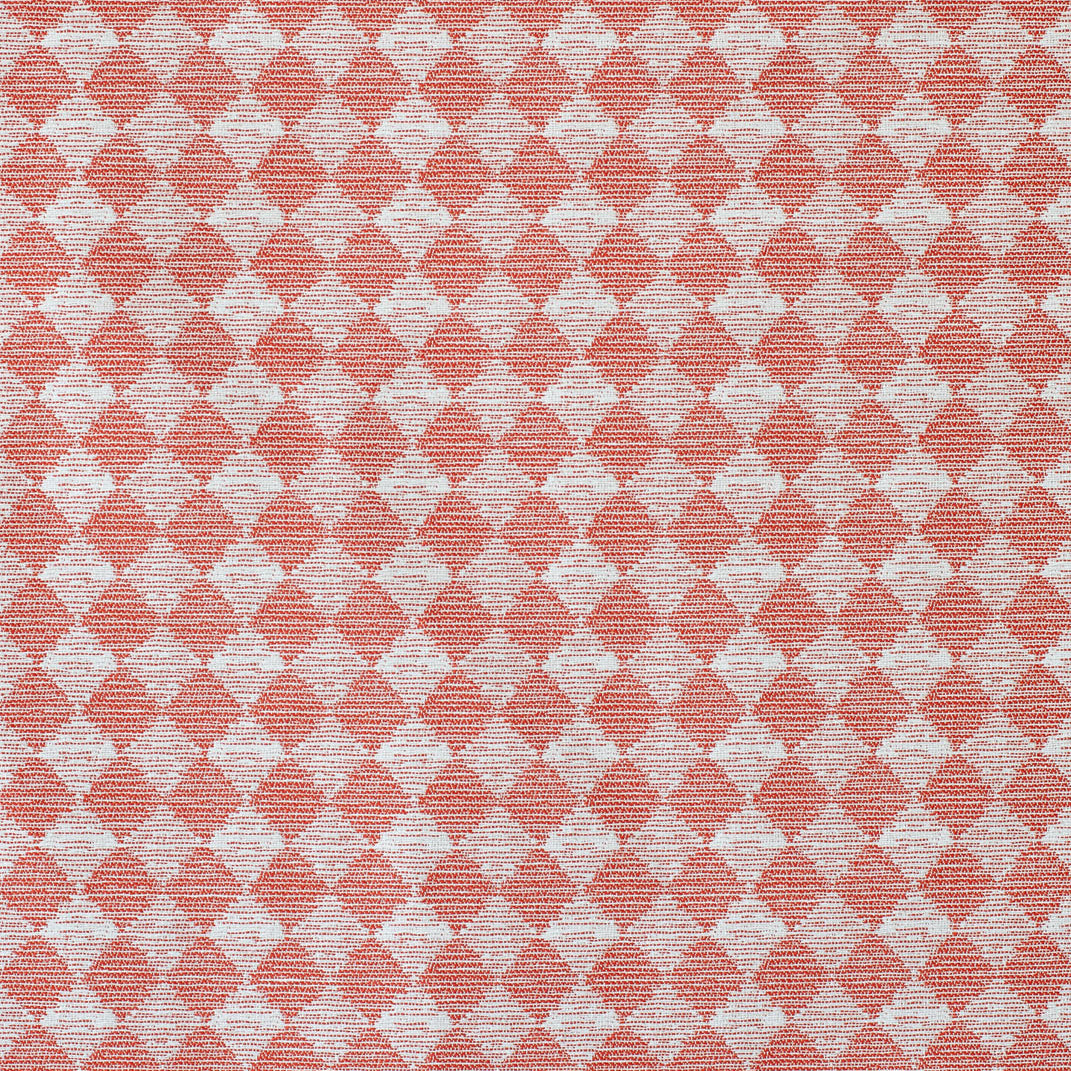 Detail of fabric in a textural diamond print in red and cream.