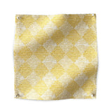 Square fabric swatch in a textural diamond print in yellow and cream.