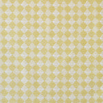 Detail of fabric in a textural diamond print in yellow and cream.