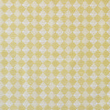 Detail of fabric in a textural diamond print in yellow and cream.