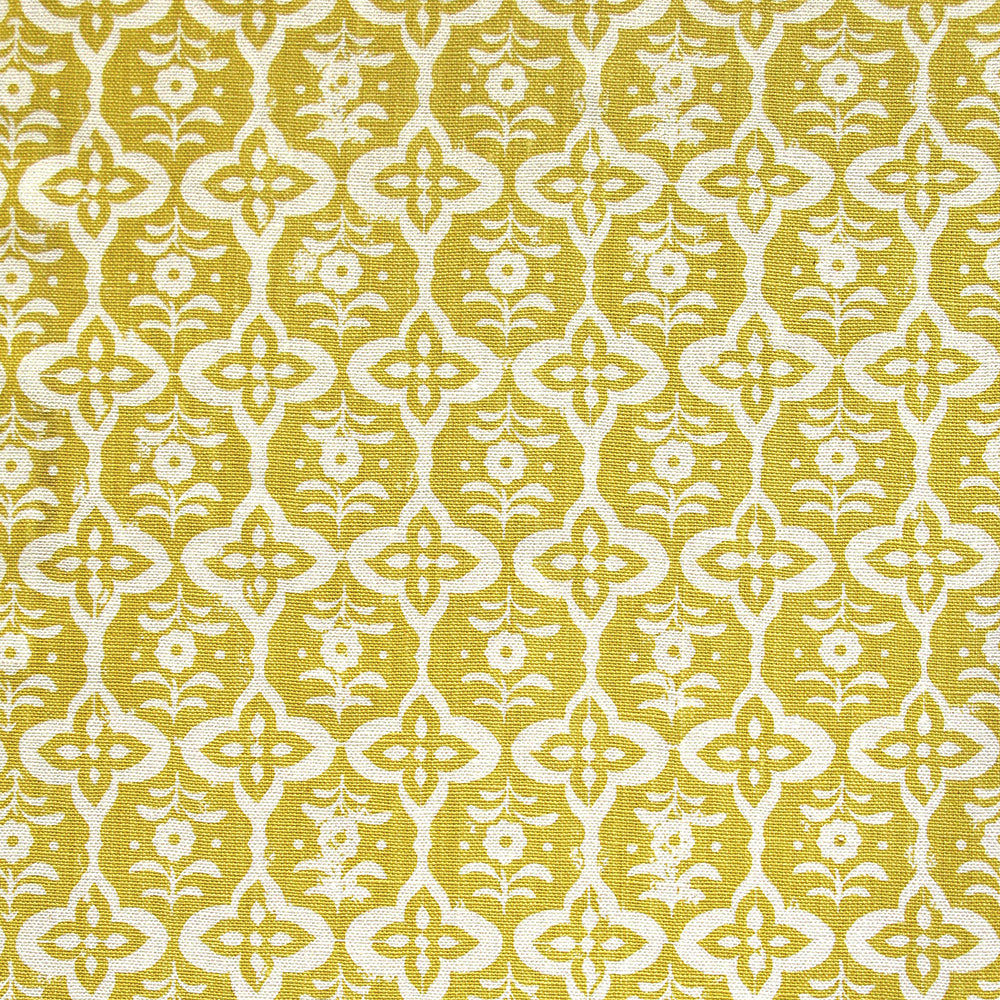 Detail of fabric in a floral grid print in cream on a mustard field.