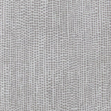 Detail of fabric in a painterly dotted print in gray on a light gray field.