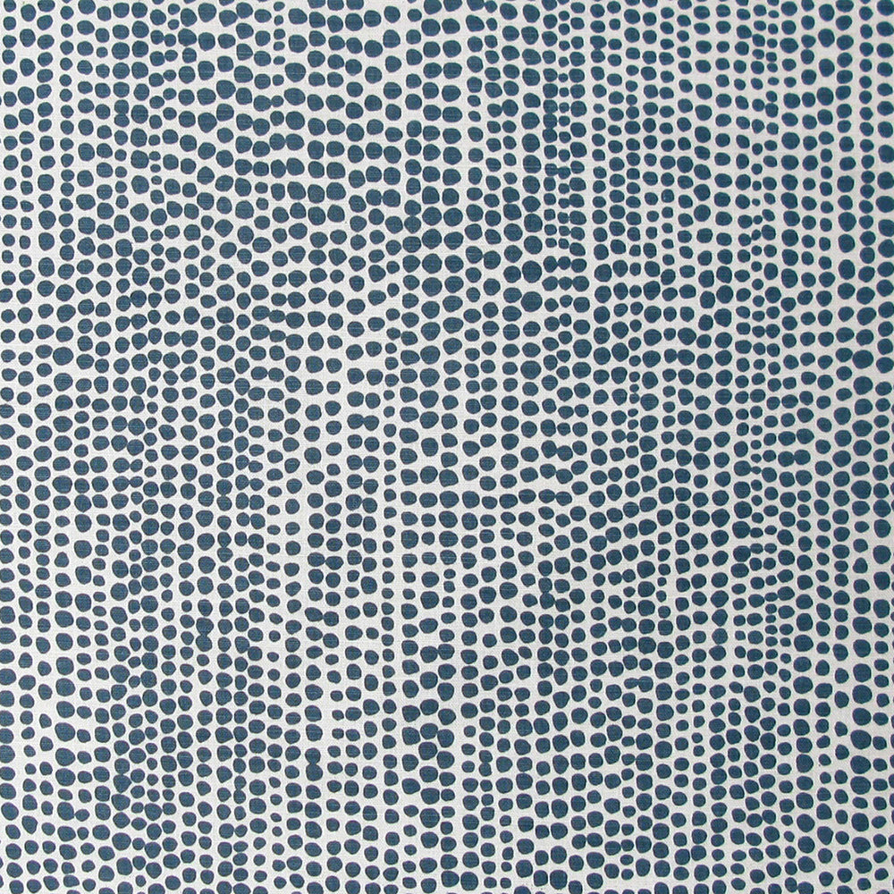 Detail of fabric in a painterly dotted print in navy on a white field.
