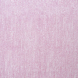 Detail of fabric in a painterly dotted print in purple on a white field.