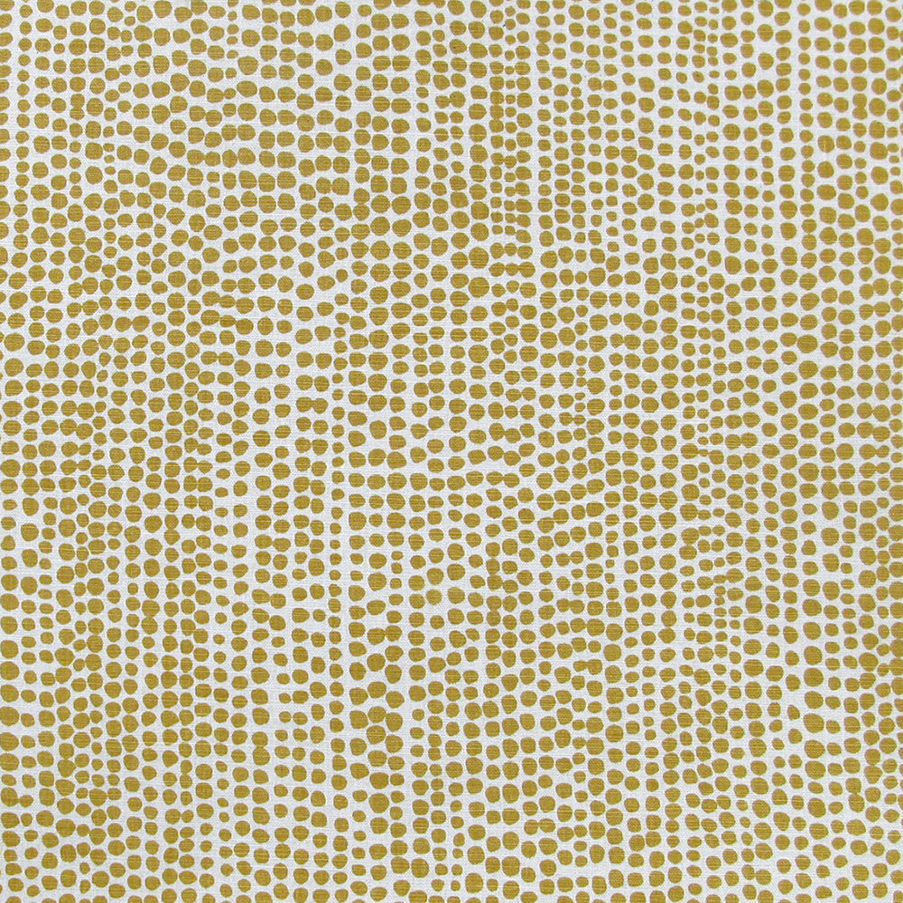 Detail of fabric in a painterly dotted print in ochre on a white field.