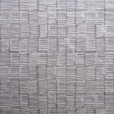 Detail of fabric in a textural grid print in gray on a light gray field.