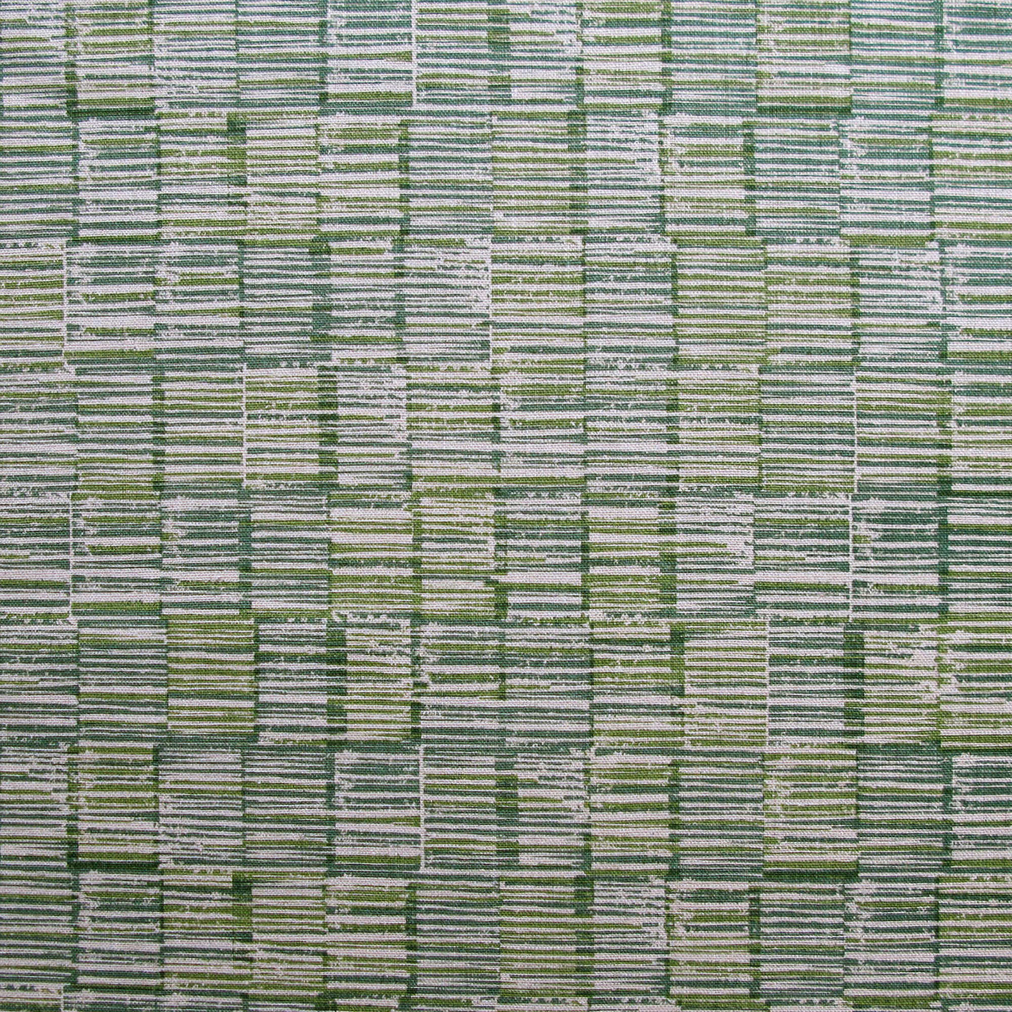 Detail of fabric in a textural grid print in blue and green on a light gray field.