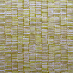 Detail of fabric in a textural grid print in mustard and tan on a light gray field.