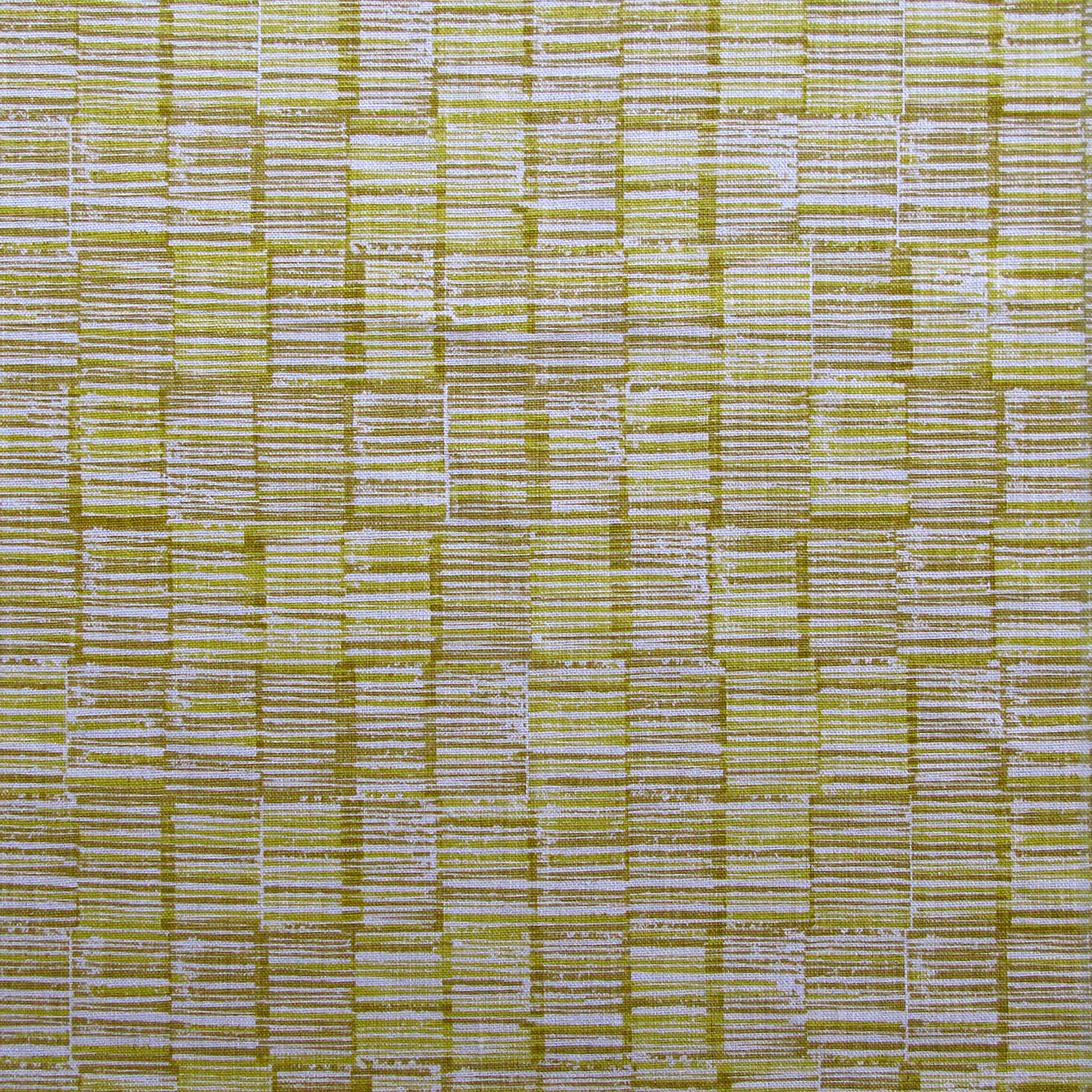Detail of fabric in a textural grid print in mustard and tan on a light gray field.