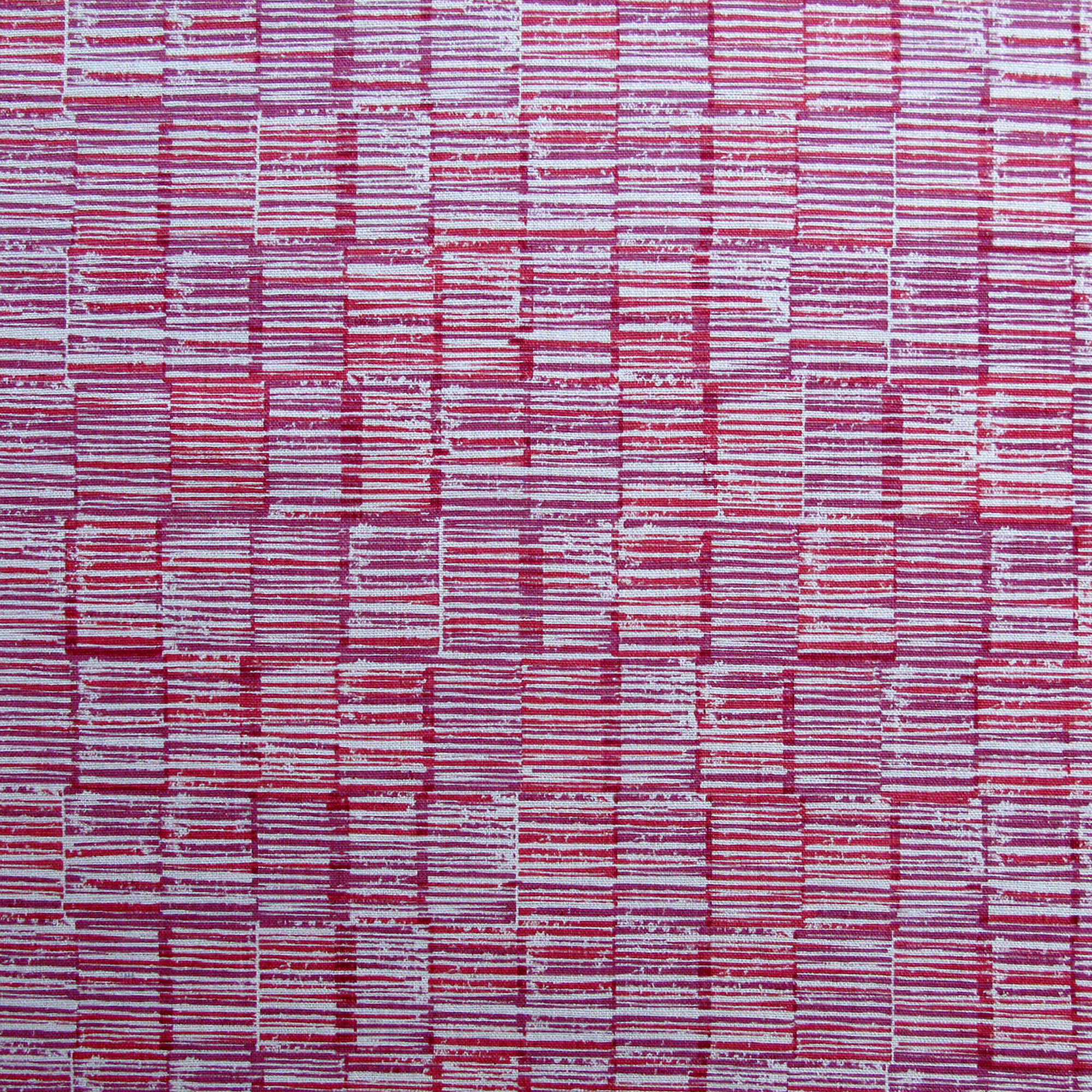 Detail of fabric in a textural grid print in pink and purple on a light gray field.