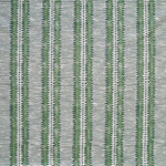 Detail of fabric in a dense tribal stripe pattern in shades of gray and green.