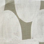 Close-up of fabric in an abstract scalloped print in white on a sage field.