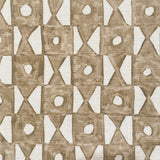 Close-up of fabric in a geometric grid print in brown on a white field.