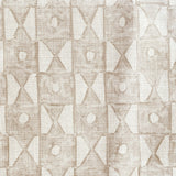 Close-up of fabric in a geometric grid print in tan on a white field.