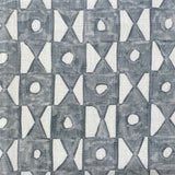 Close-up of fabric in a geometric grid print in navy on a white field.