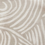 Close-up of fabric in an abstract linear print in white on a cream field.