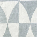 Close-up of fabric in a curvilinear grid print in light blue on a white field.