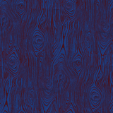 Detail of wallpaper in a textural wood grain print in red on a blue field.