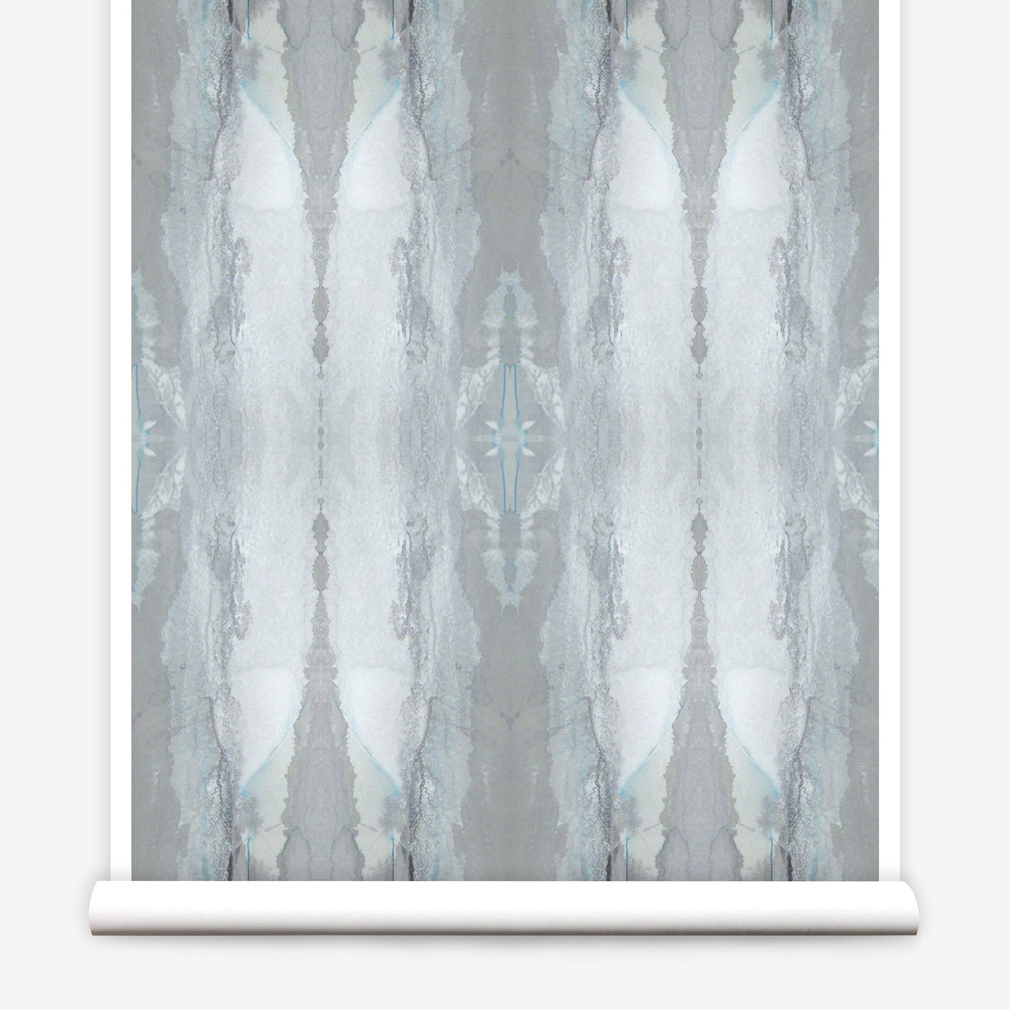 Partially unrolled wallpaper yardage in an abstract textural print in shades of gray and blue-gray.