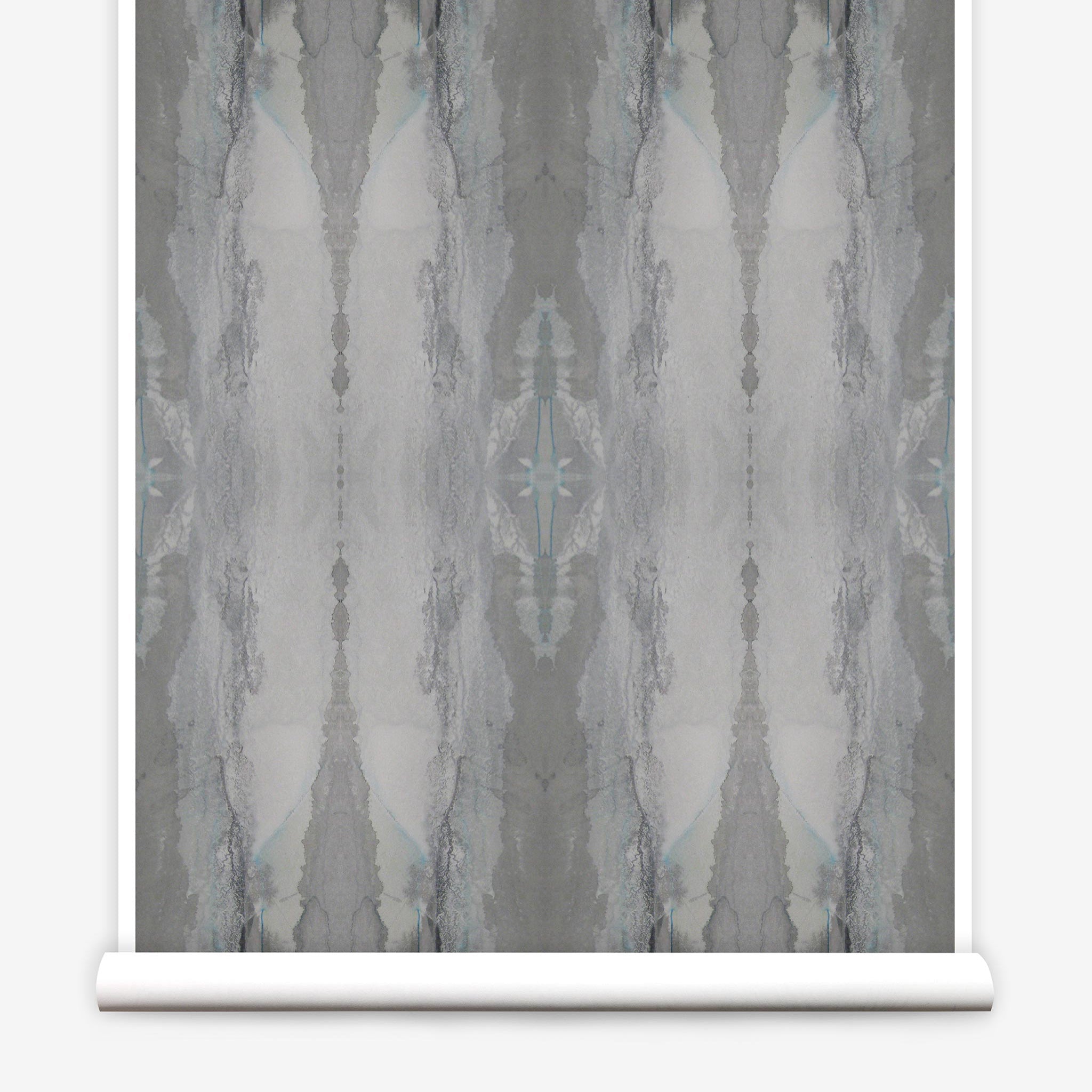 Partially unrolled wallpaper yardage in an abstract textural print in shades of gray.