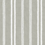 Detail of wallpaper in a textural stripe pattern in white on a greige field.