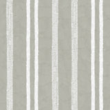 Detail of wallpaper in a textural stripe pattern in white on a greige field.