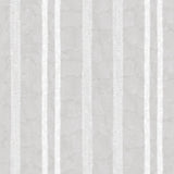 Detail of wallpaper in a textural stripe pattern in white on a light gray field.